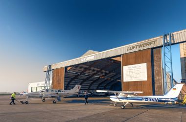Airport hangar with airplanes
